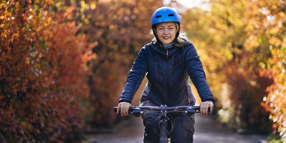 Mature woman riding back in autumn